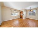 Open living area with hardwood floors, natural light, and a warm, inviting atmosphere at 4157 Perry St, Denver, CO 80212