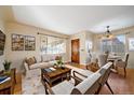 Inviting living room and dining area with elegant furnishings and hardwood floors at 4157 Perry St, Denver, CO 80212