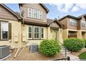 Townhouse exterior with well-kept landscaping and a welcoming front entrance at 5836 S Vivian Way, Littleton, CO 80127