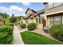 Inviting townhouse exteriors with lush greenery and well-maintained landscaping at 5836 S Vivian Way, Littleton, CO 80127