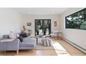 Beautiful living room with hardwood floors, stylish decor, and a sliding door at 330 Ptarmigan St, Golden, CO 80403