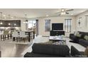 Open concept kitchen and dining area with modern cabinetry and stainless steel appliances at 9091 E 59Th North Pl, Denver, CO 80238