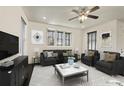 Spacious living room featuring a neutral color palette and ample natural light at 9091 E 59Th North Pl, Denver, CO 80238