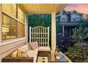 Inviting front porch with comfortable seating area to enjoy neighborhood views at 3240 Spruce St, Denver, CO 80238