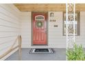 Inviting front door with wreath and visible house number '3198' at 3198 W Amherst Ave, Denver, CO 80236