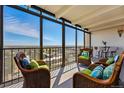 Sunroom with large windows offering panoramic views of the city and surrounding landscape at 7877 E Mississippi Ave # 1008, Denver, CO 80247