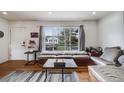Cozy living room with a built-in window seat, hardwood floors, and a view of the outdoors at 3200 Eastman Ave, Boulder, CO 80305