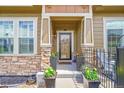 Cozy front porch with stone accents, perfect for relaxing and enjoying the outdoors at 3751 W 136Th Ave # F4, Broomfield, CO 80023
