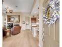 Inviting living area with hardwood floors, fireplace, and seamless flow into the kitchen at 3751 W 136Th Ave # F4, Broomfield, CO 80023
