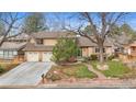 Charming home with a three-car garage, a beautifully landscaped front yard, and mature trees at 11545 Quivas Way, Westminster, CO 80234