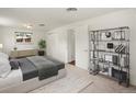 Spacious bedroom with a closet, a dresser, a bed, a rug, and natural light at 945 Emerald St, Broomfield, CO 80020