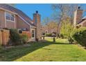Spacious backyard with lush green grass, mature trees, and privacy fencing, perfect for outdoor enjoyment at 13462 E Asbury Dr, Aurora, CO 80014