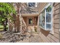 Inviting front door with decorative accents and large bay window offering curb appeal and natural light at 13462 E Asbury Dr, Aurora, CO 80014