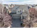 Attractive two-story home with neat landscaping, a two-car garage, and a well-maintained roof at 9978 Salida St, Commerce City, CO 80022