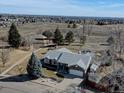 Areal view showcasing the home's location near open space, trails, and community amenities at 7160 S Jellison St, Littleton, CO 80128
