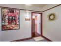 Inviting condo entryway with hardwood floors and art at 624 Pearl St # 301, Boulder, CO 80302