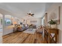 Bright living room with hardwood floors, comfortable seating, and stylish decor at 18263 E Mansfield Ave, Aurora, CO 80013