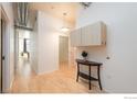 Bright entryway with wood floors and storage at 3100 Huron St # 3P, Denver, CO 80202