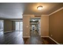 A open concept living room, showcasing the kitchen and outdoor patio access at 12208 W Dorado Pl # 207, Littleton, CO 80127