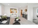 Cozy living room featuring modern furnishings, stylish decor, and a convenient wet bar for entertaining guests at 1236 N Tennyson St, Denver, CO 80204