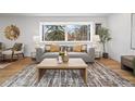 Cozy living room with natural light, modern sofa, and wooden coffee table at 456 Cherry St, Denver, CO 80220