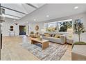 Bright living room with a large window, light hardwood floors, and stylish decor at 456 Cherry St, Denver, CO 80220