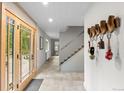 Bright foyer with light walls, tile floors, and glass doors that flood the space with natural light at 592 Brook Dr, Idaho Springs, CO 80452