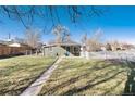 Charming home featuring a spacious backyard with a mix of wooden and picket fences at 377 Stuart St, Denver, CO 80219