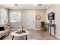 Bright and airy living room with modern decor, hardwood floors, and large windows at 377 Stuart St, Denver, CO 80219