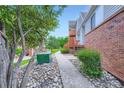 Townhouse exterior featuring landscaping and brick accents, adding visual appeal at 4135 E 119Th Pl # A, Thornton, CO 80233