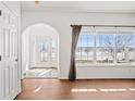 Bright and spacious entryway with hardwood floors and a view to the backyard at 51 W 6Th Pl, Byers, CO 80103