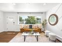 Inviting living room with a large window and comfortable contemporary furnishings at 5167 S Pearl St, Littleton, CO 80121