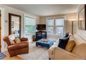 Inviting living room with ample natural light, comfortable seating, and stylish decor at 4654 Bryant St, Denver, CO 80211