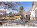 Spacious backyard with a concrete patio featuring outdoor seating, perfect for entertaining guests at 1811 S Norfolk St, Aurora, CO 80017