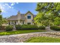 Charming two-story home with well-maintained landscaping and beautiful stone details at 2117 S Troy Way, Aurora, CO 80014