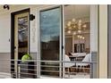 Stylish townhome exterior with modern design details and an inviting front entrance, view to dining room at 4035 Fenton Ct, Wheat Ridge, CO 80212