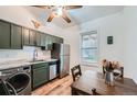 Bright kitchen featuring stainless steel appliances and a dining area illuminated by a window at 3127 W 28Th Ave # 2, Denver, CO 80211