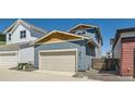 Detached two-car garage with a contemporary design and convenient side access at 920 Promenade Dr, Superior, CO 80027