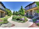 Pleasant street view showcasing the property's location with sidewalks, landscaping, and well-maintained homes at 3450 Valentia St, Denver, CO 80238