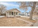 Inviting home featuring a well-manicured lawn and a classic design at 1735 Dayton St, Aurora, CO 80010