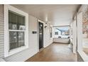 Covered front porch featuring a classic design and ample natural light at 1735 Dayton St, Aurora, CO 80010