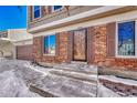 Brick front exterior with steps leading to the front door at 16806 E Villanova Cir, Aurora, CO 80013