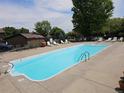Community pool area features lounge chairs and a sparkling, refreshing pool at 7000 W 20Th Ave # 106, Lakewood, CO 80214