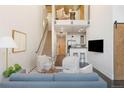 Open-concept living space with modern furnishings, high ceilings, and access to a kitchen and loft area at 2506 16Th St, Denver, CO 80211