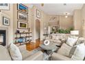 Spacious living room showcases a fireplace, high ceilings, and abundant natural light at 8617 Gold Peak Dr # G, Highlands Ranch, CO 80130