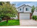 Charming two-story home with mature trees, a well-maintained lawn, and a two-car garage at 2940 E Yarrow Cir, Superior, CO 80027