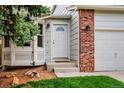 Welcoming front entrance featuring a white door with sidelights and brick detailing at 2940 E Yarrow Cir, Superior, CO 80027