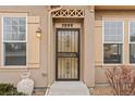 Charming home front entrance with secure wrought iron door and number 5899 clearly displayed at 5899 S Taft Ter, Littleton, CO 80127