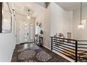 Inviting home entryway featuring high ceilings, modern lighting, and stylish accents, perfect for welcoming guests at 445 Panoramic Dr, Monument, CO 80132