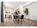 Stylish dining area featuring a modern table set and natural light at 23527 E 5Th Pl, Aurora, CO 80018